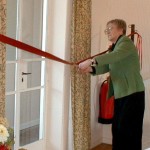 Marie cutting ribbon